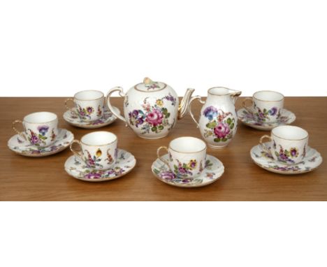 Samson floral tea set comprising a teapot, cream jug, six teacups and six saucers, with moulded decoration, painted with flow