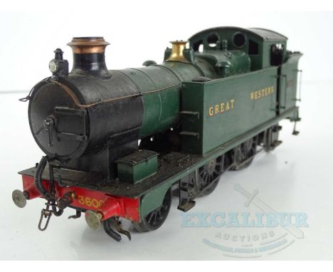 A kitbuilt O gauge standard scale GWR 3400 class 2-4-2 steam tank locomotive in GWR green livery numbered 3600, together with