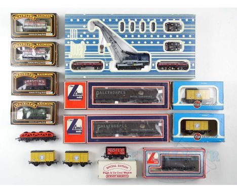 A mixed group of boxed and unboxed OO gauge wagons by LIMA, MAINLINE and others together with a JOUEF HO gauge Cockerill cran