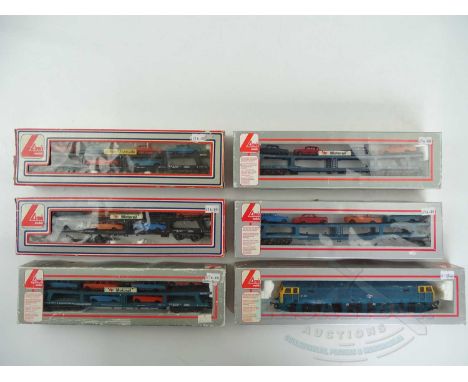 A HORNBY OO gauge class 47 diesel locomotive in BR blue (incorrect Lima box) together with a group of Motorail wagons - G in 