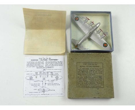 A Pre-War DINKY Toys 62G Boeing 'Flying Fortress' in silver with gliding hole and gliding game leaflet plus reproduction airc