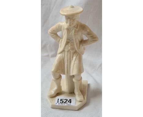 A Royal Worcester figure of a seated man - 6" high 