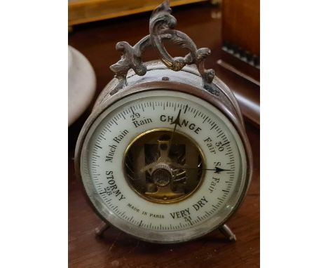 A small brass table barometer
