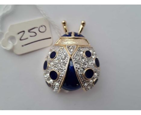 A unusually largecostume brooch with enamel and stone set in the form a lady bird