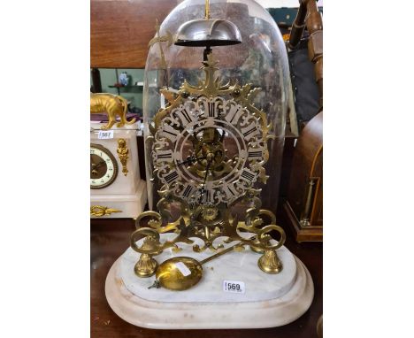 A 19th Century brass skeleton mantle clock with single fusee. Glass dome damaged at base 