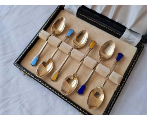 A box set of six Art Deco style silver gilt spoons, decorated with enamel, B'ham 1909 by SL