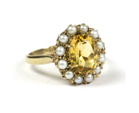 A citrine and seed pearl cluster ring, in a galleried setting to a 9ct gold shank, size O