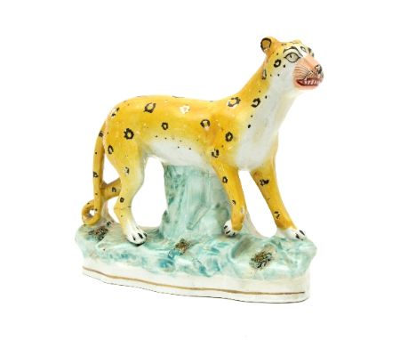 A Staffordshire figure of a leopard, 19th Century, 19cm high/see illustration   Condition Report:  Crack through back leg, ha
