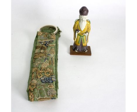 A Chinese bell pull with ivory ring handle and a ceramic figure of Shou Lao