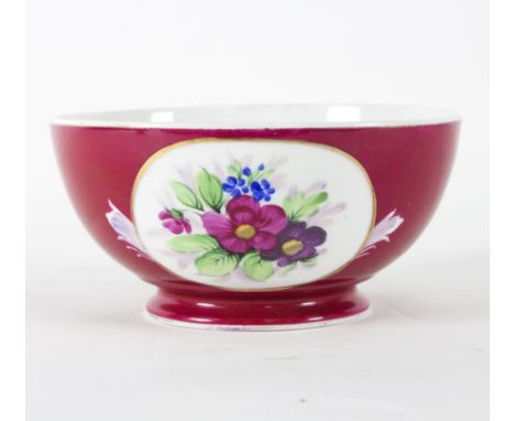 An Imperial Russian Gardner porcelain bowl, painted with two floral bouquets in ovals on a crimson ground, 18cm wide   Condit