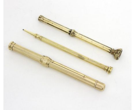 A gold propelling pencil by S Mordan & Co. with engine turned decoration to body and set with an intaglio hardstone seal, ano