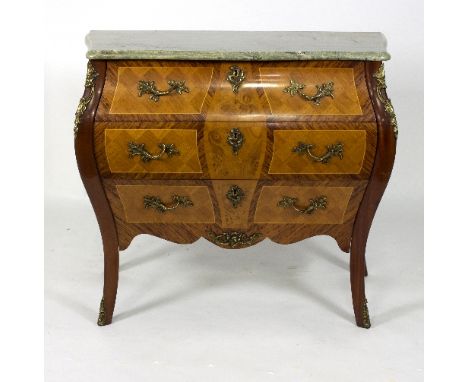 A bombé front commode with marble top and gilt metal mounts, fitted three drawers, 89cm wide