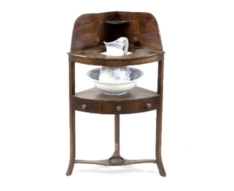A George III mahogany corner washstand with associated jug and basin