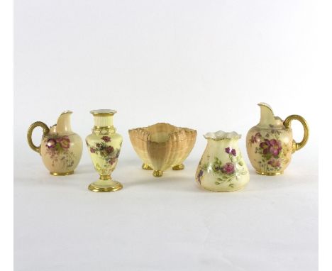 Five pieces of Royal Worcester blush ivory porcelain, comprising two 1094 pattern jugs, two vases and a shell shaped bowl