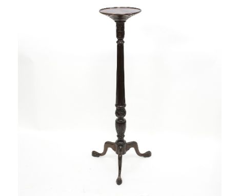 A mahogany torchère on a fluted column and tripod support, 106cm high