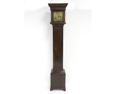 A brass faced eight-day dwarf longcase clock, the oak case with blind fret freeze to the hood, the trunk enclosed by a twin-a