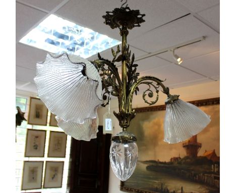 A late 19th Century four-light electrolier with foliate scroll supports and glass shades, 65cm high