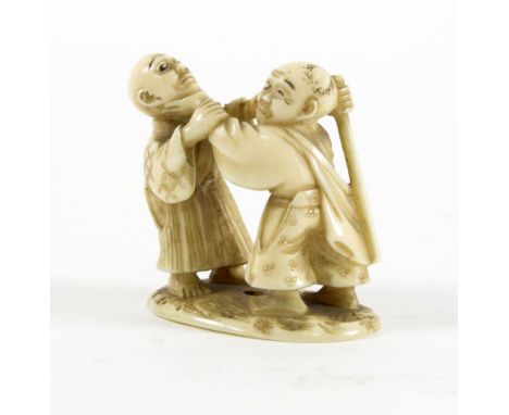 A Japanese carved ivory netsuke, Tokyo school, late 19th Century, depicting two blind men fighting, on an oval base with a na