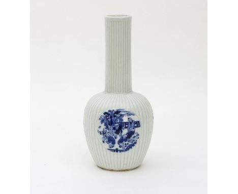 A Chinese porcelain ribbed vase with three circular panels in blue and white depicting boys playing, 25cm high   Condition Re
