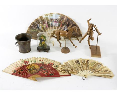 A 19th Century wax model of a boy playing an instrument set under a glass dome, 15cm high, a silk print of a boy playing a dr