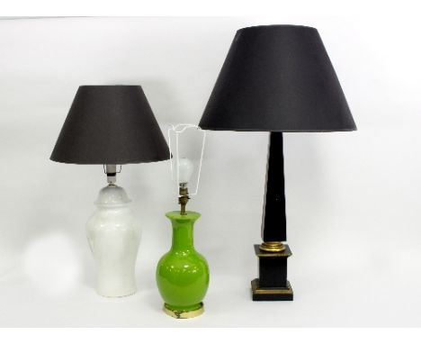 A table light with parcel gilt obelisk support and two table lights with vase shaped supports