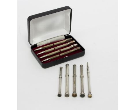 Five silver propelling pencils, makers to include Mordan & Co., Carter & Bromley and Wilmot & Co., each with engine turned bo