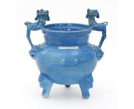 A Chinese turquoise glaze censer with dog handles and panel of script on squat grotesque mask capped legs, 22.5cm high   Cond