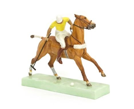 A Royal Worcester figure, 'The Polo Player', modelled by Doris Lindner, the plinth 20cm long/see illustration   Condition Rep