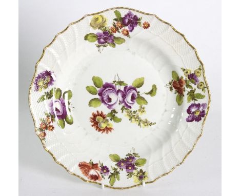 A Vienna plate with painted flowers and ozier moulded border, circa 1810, 24cm diameter   Condition Report:  Rubbing to glaze