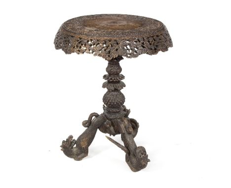 An Indian colonial hardwood occasional table, the circular tilt-top on pineapple column and tripod support, 61cm diameter