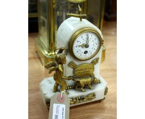 A French marble mantel clock with Cupid walking a dog, the plaque inscribed 'N'oubliez Pas L'amour' on support, 20cm high   C