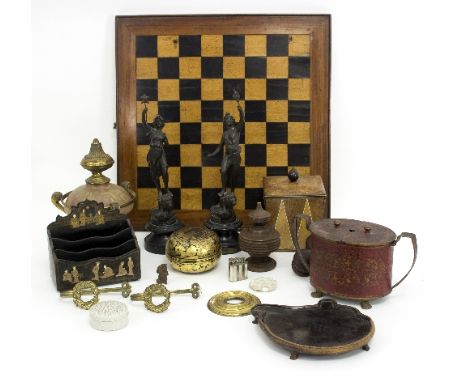 A toleware caddy with hinged cover, a wooden draughts board, a gilt metal and glass burner and a pair of metal figures standi