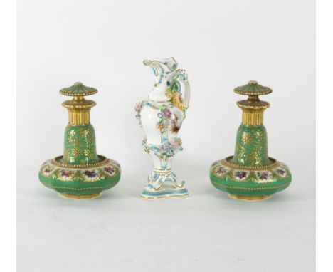 A pair of French porcelain dressing table bottles, mid 19th Century, painted flowers to a green ground, 15cm high and a small