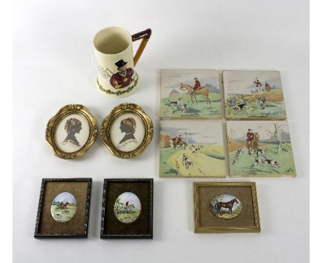 A Crown Devon John Peel mug, mechanism broken, 15.5cm high, four tiles depicting hunting scenes, three oval enamel plaques de