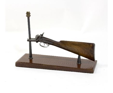 A table lamp converted from a hammer gun, the side plate signed W Richards, the plinth 56cm long