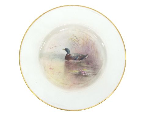 A Royal Worcester plate by Jas Stinton, painted a mallard on a pond, date code for 1940, retailed by Henry Morgan & Co., Mont