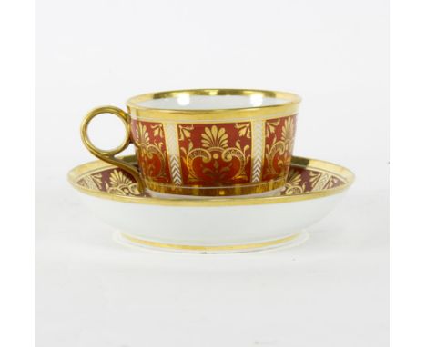 A Barr Flight & Barr porcelain cup and saucer, painted burnt orange panels highlighted in gilt, each with painted script to b