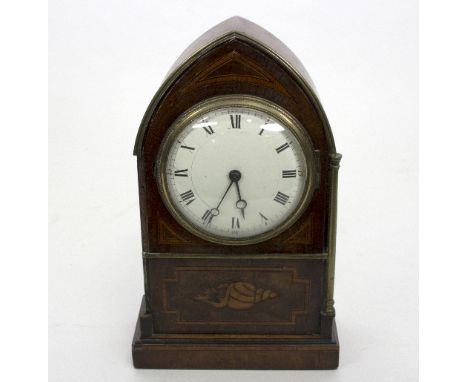 An Edwardian mantel clock, the inlaid arch top case with circular white enamel dial, lacks pendulum, 26.5cm high