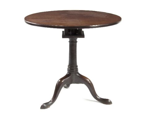 A George III mahogany birdcage action tripod table, the circular tapered column on cabriole legs with pad feet, 78cm diameter