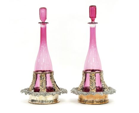 A pair of Victorian Sheffield plate coasters with grapes and vines to the borders and acanthus decorated slatted decanter sup