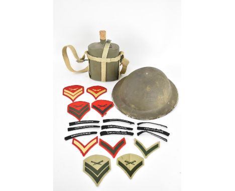 A WWII style olive green 'Brodie' British steel helmet together with Second World War era water bottle and modern United Stat