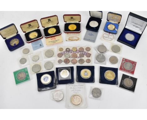 A group of commemorative boxed coins to include the sterling silver Princess Elizabeth and Prince Philip Royal Wedding coin, 