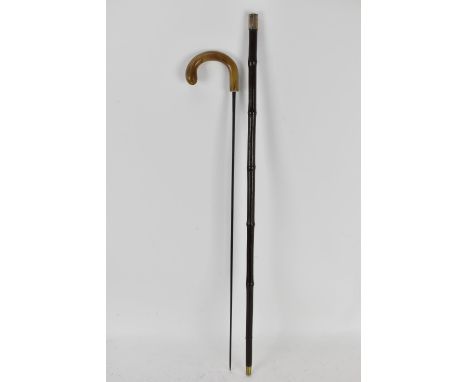 An early 20th century sword stick having a horn handle, soft wood in the form of bamboo 