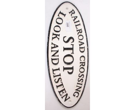 A vintage style reproduction Railway Stop Sign in cast iron with raised notation 