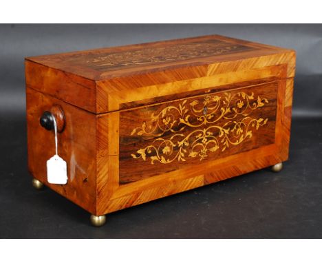 A Stunning 19th century walnut crossbanded and marquetry inlaid tea caddy raised on ball finial feet. The lined interior with