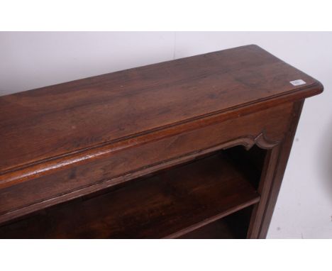 A 19th century French country oak open window bookcase cabinet. Raised on tall plinth having arcade style central open window