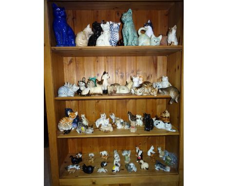 A group of 20th century and later ceramic cats of various shapes and sizes, (qty). 