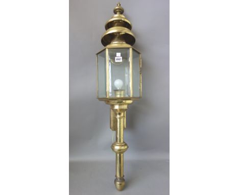 A large Victorian style gilt metal coaching lamp, modern, of hexagonal form, with inset bevelled glass panels, 100cm, and ano