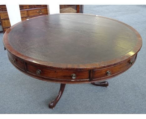 A George III mahogany drum table, with four true and four false frieze drawers, on later tripod base, 139cm deep x 78cm high.