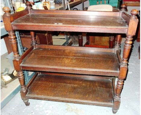 A Victorian oak three tier buffet, on ring turned tapering supports, 102cm wide x 112cm high.
